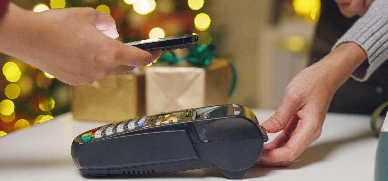 Credit Card machine with holiday tree in background
