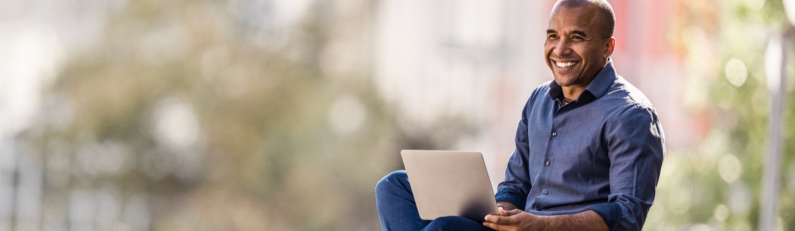 Man smiling and viewing paperwork