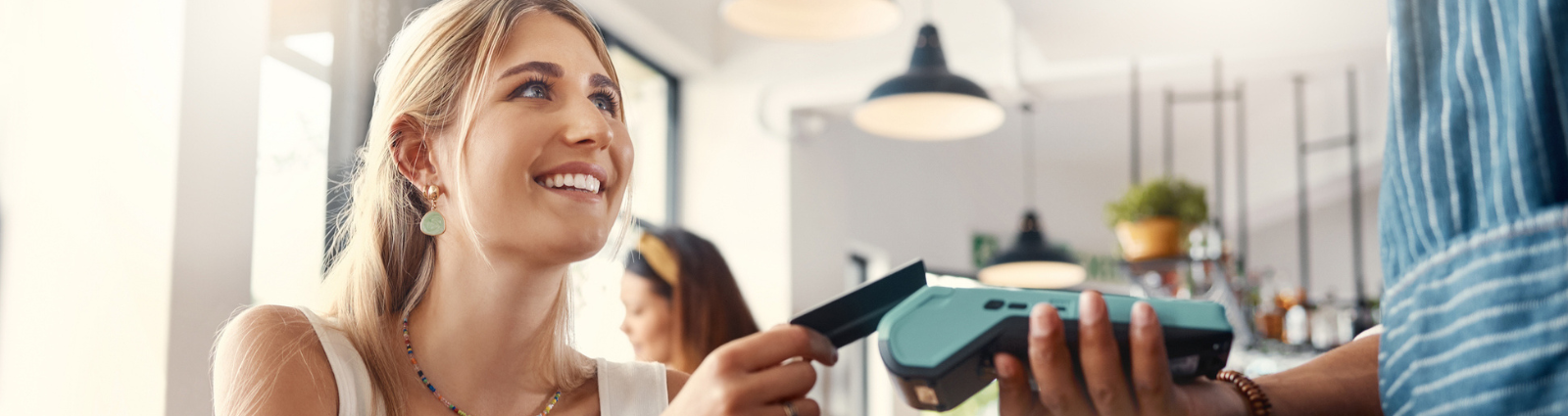 Woman paying with credit card