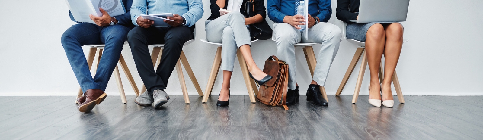 Employees sitting in row of chairs